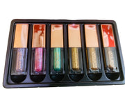 Set of metallic glow liquid eyeshadow in a black tray with visible brand name.