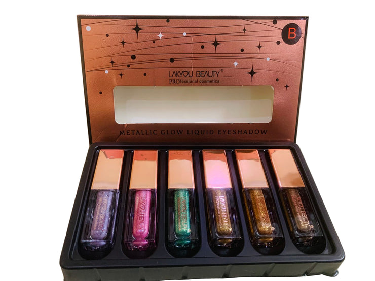Set of metallic glow liquid eyeshadows in a LAVOU BEAUTY box on a light background