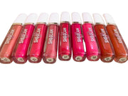 Row of SHEGLAM lip glosses on a light background