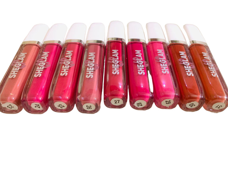 Row of SHEGLAM lip glosses on a light background